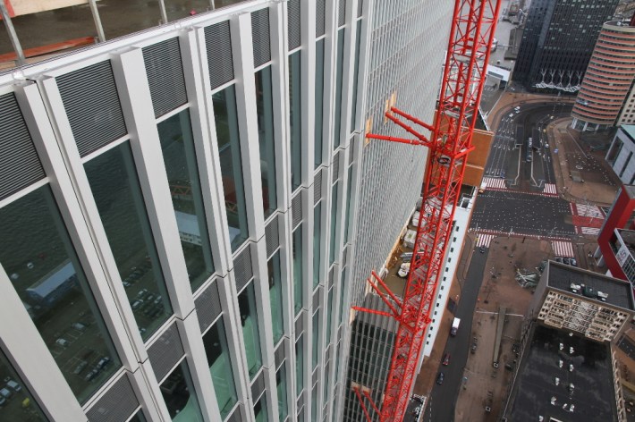 imagine envelope, photography architecture of highrise buildings designed by OMA architects in the city of Rotterdam, the largest highrise building in the Netherlands, unitized facade construction site