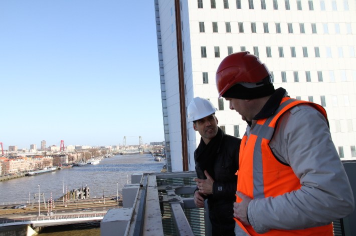 imagine envelope, photography architecture of highrise buildings designed by OMA architects in the city of Rotterdam, the largest highrise building in the Netherlands, unitized facade construction site